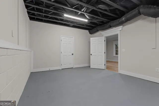 a view of a house with wooden deck