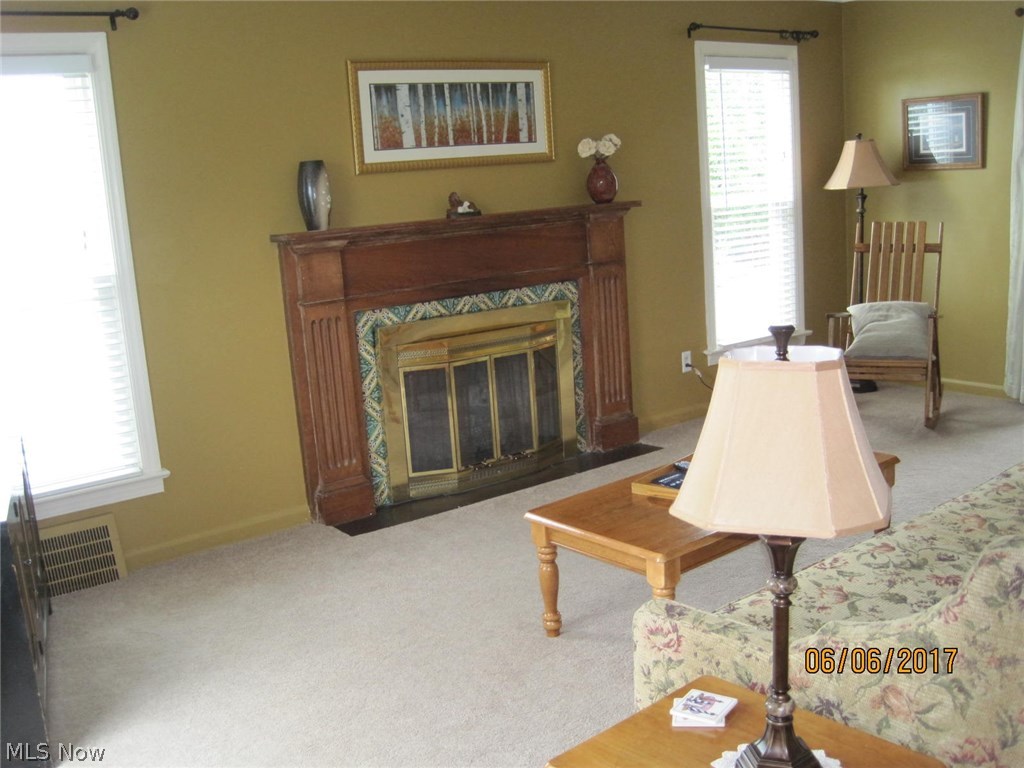 4458 Silsby Road University Heights, OH 44118 - Photo 6 of 19 Pretty tiles surround fireplace