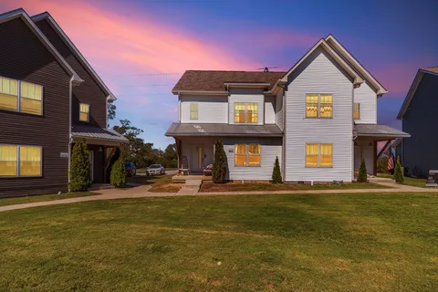 a front view of a house with a yard