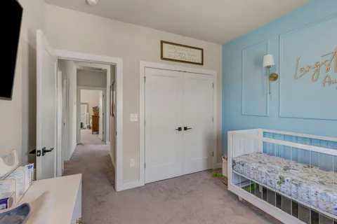 a bedroom with a bed and a view of bathroom
