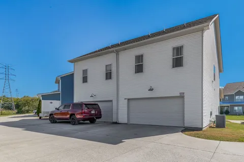 a view of car parked in front of house