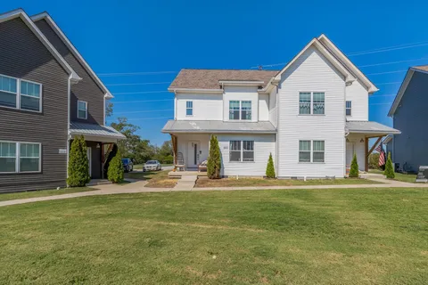 a front view of a house with a yard