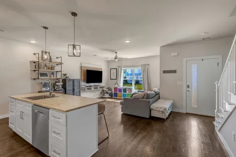 a view of living room with furniture and flat screen tv