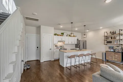 a kitchen with a table and chairs in it