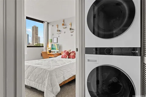 a bedroom with a bed and a mirror