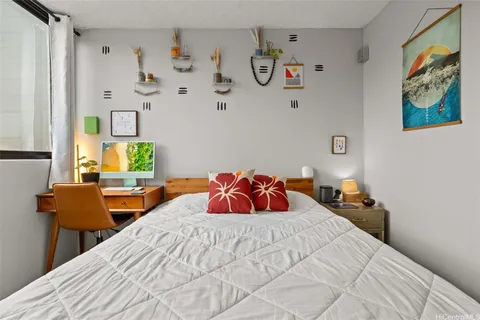 a bedroom with a bed and window