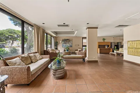 a living room with furniture and a large window