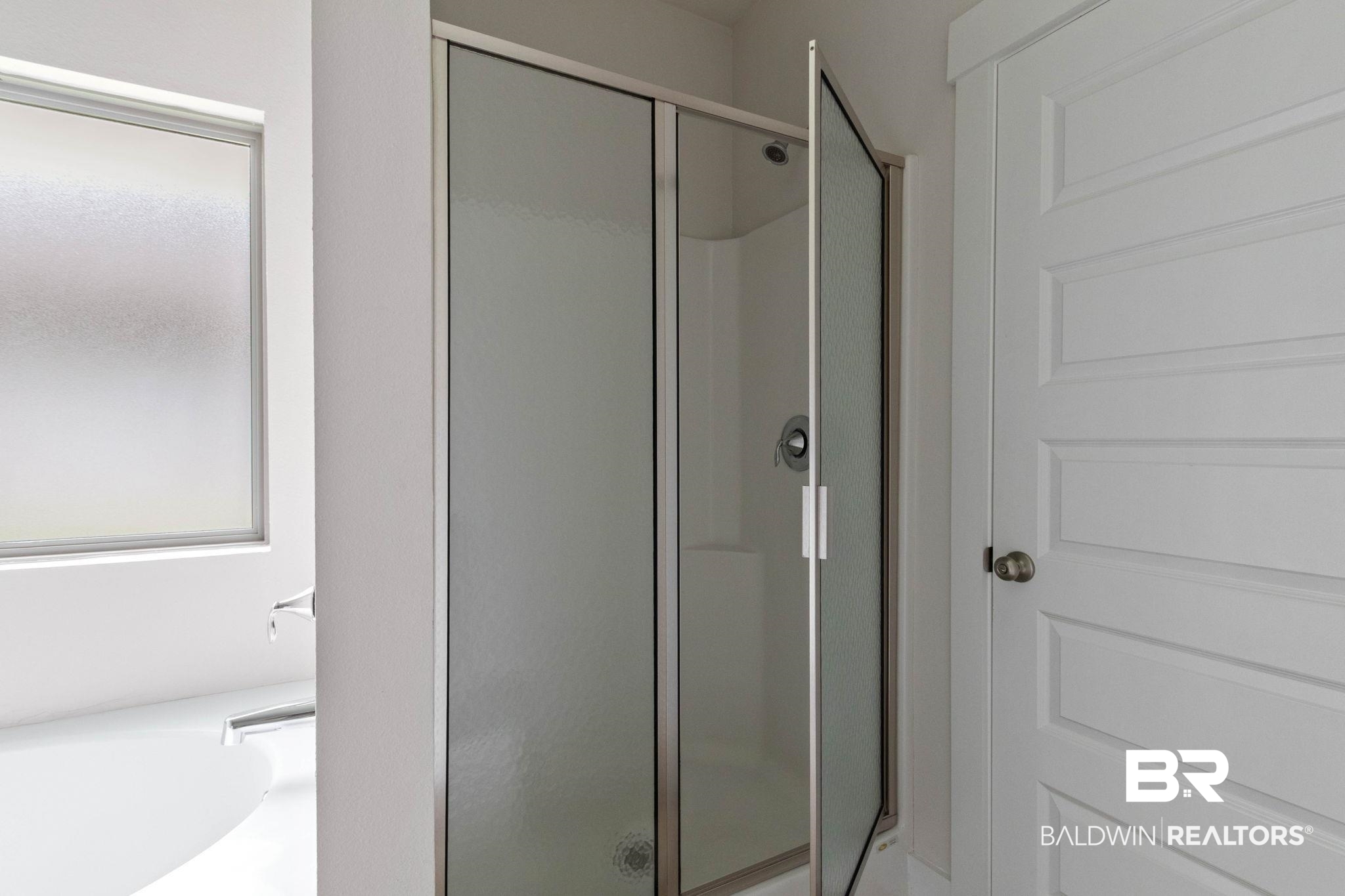 1710 Grouse Street Foley, AL 36535 - Photo 45 of 76 Modern shower enclosure with frosted glass panels and chrome hardware