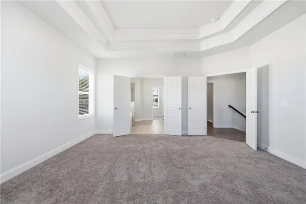 a view of empty room with a fireplace