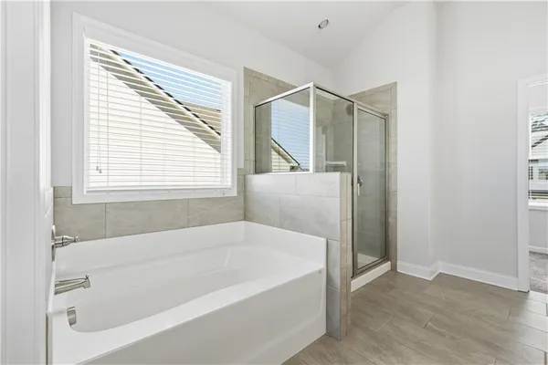 a white bath tub sitting next to a window