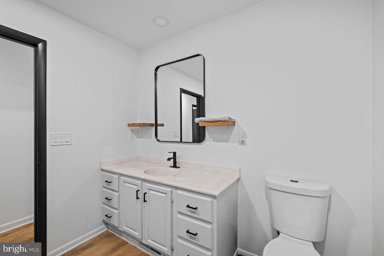 1958 High Street York, PA 17408 - Photo 16 of 38 a bathroom with a toilet sink and mirror