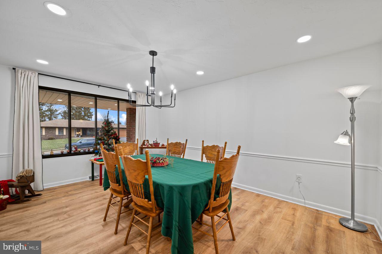 1958 High Street York, PA 17408 - Photo 10 of 38 a view of a dining room with furniture window and wooden floor
