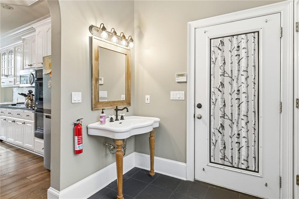 4337 Mountain View Road Oakwood, GA 30566 - Photo 20 of 84 a bathroom with a sink tub and a mirror