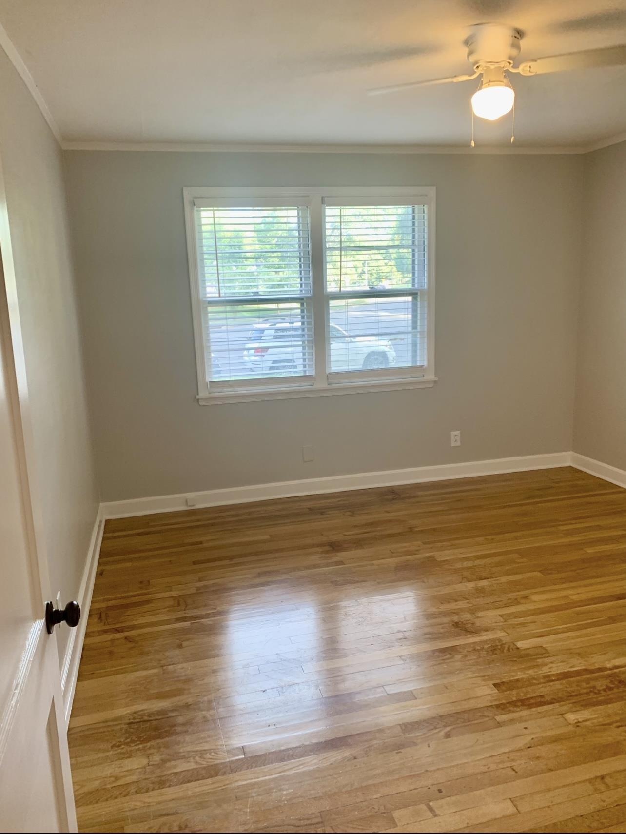 505 High Point Terrace Memphis, TN 38122 - Photo 17 of 29 Unfurnished room with baseboards, wood finished floors, and ornamental molding
