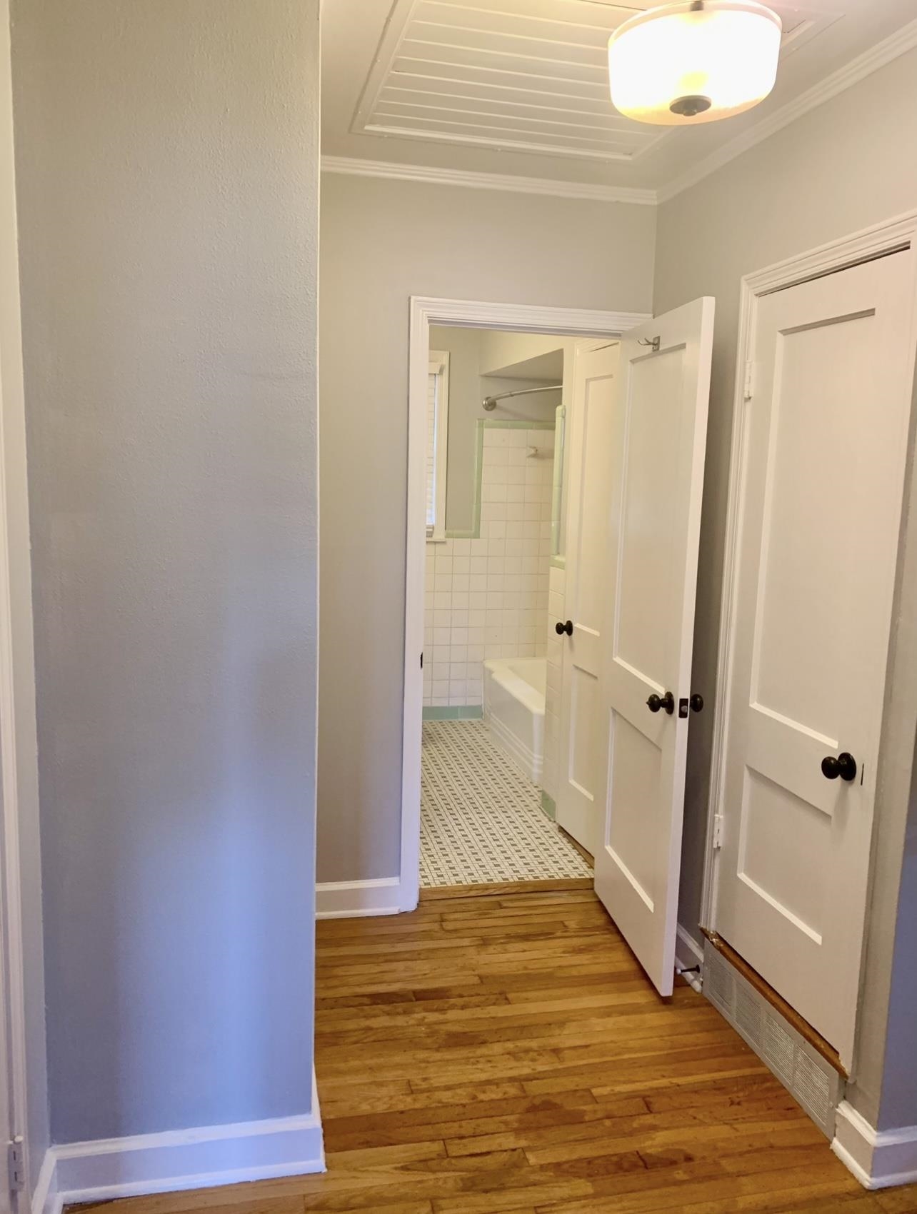 505 High Point Terrace Memphis, TN 38122 - Photo 23 of 29 Corridor with baseboards, wood finished floors, and ornamental molding