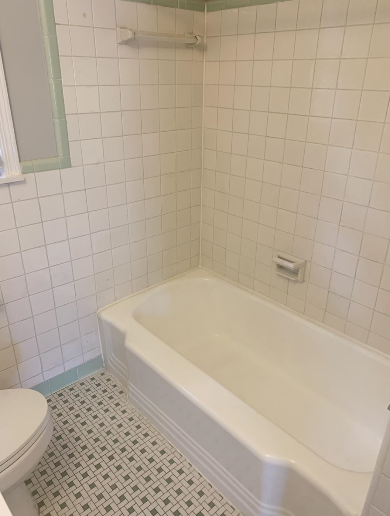 505 High Point Terrace Memphis, TN 38122 - Photo 26 of 29 Bathroom featuring toilet, tile patterned floors, and tile walls