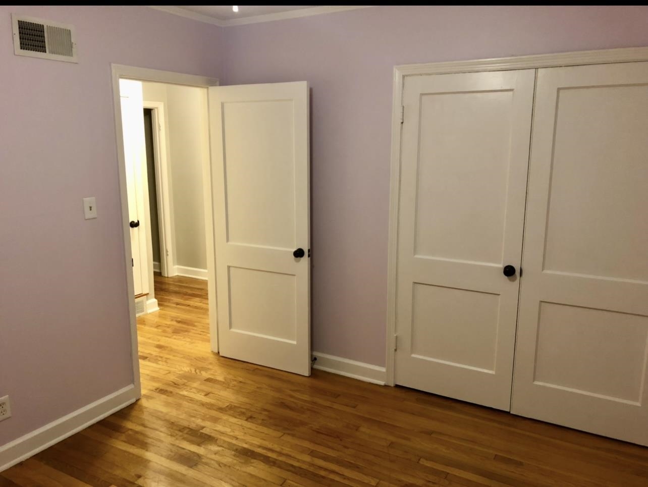 505 High Point Terrace Memphis, TN 38122 - Photo 27 of 29 Unfurnished bedroom with baseboards, visible vents, a closet, and light wood-style flooring