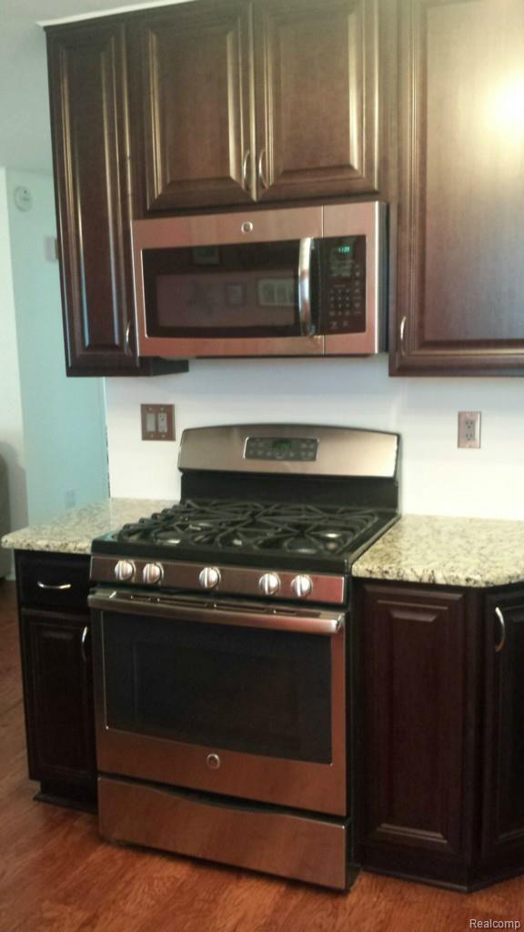 5369 Ridgemont Street Howell, MI 48843 - Photo 15 of 25 More cabinet storage with stainless steel appliances.