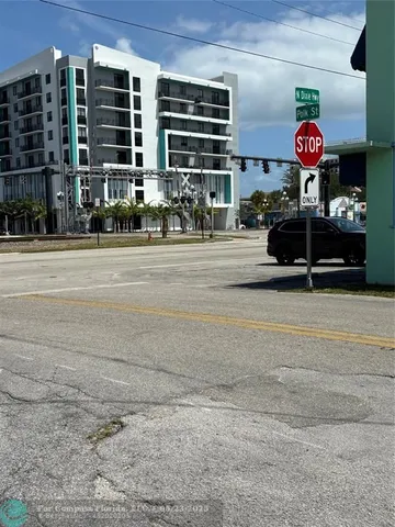 a front view of a building with street view