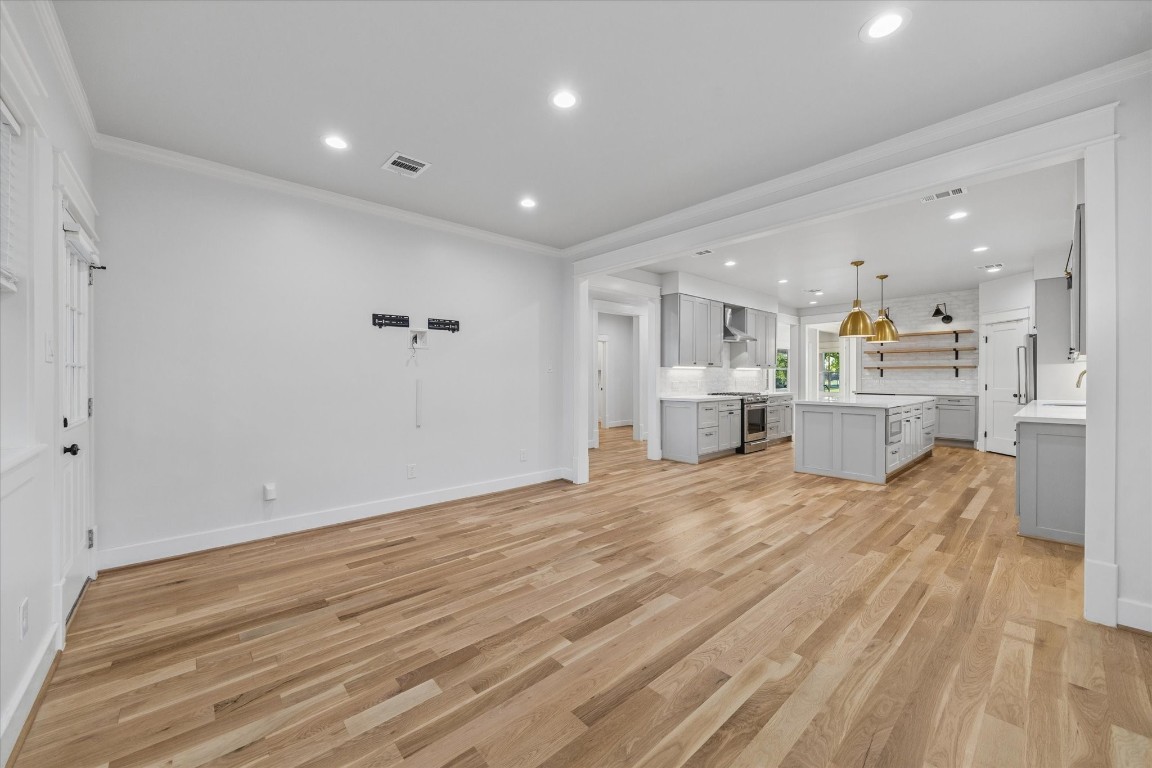 910 Northwood Street Houston, TX 77009 - Photo 15 of 41 a view of a kitchen with furniture and wooden floor