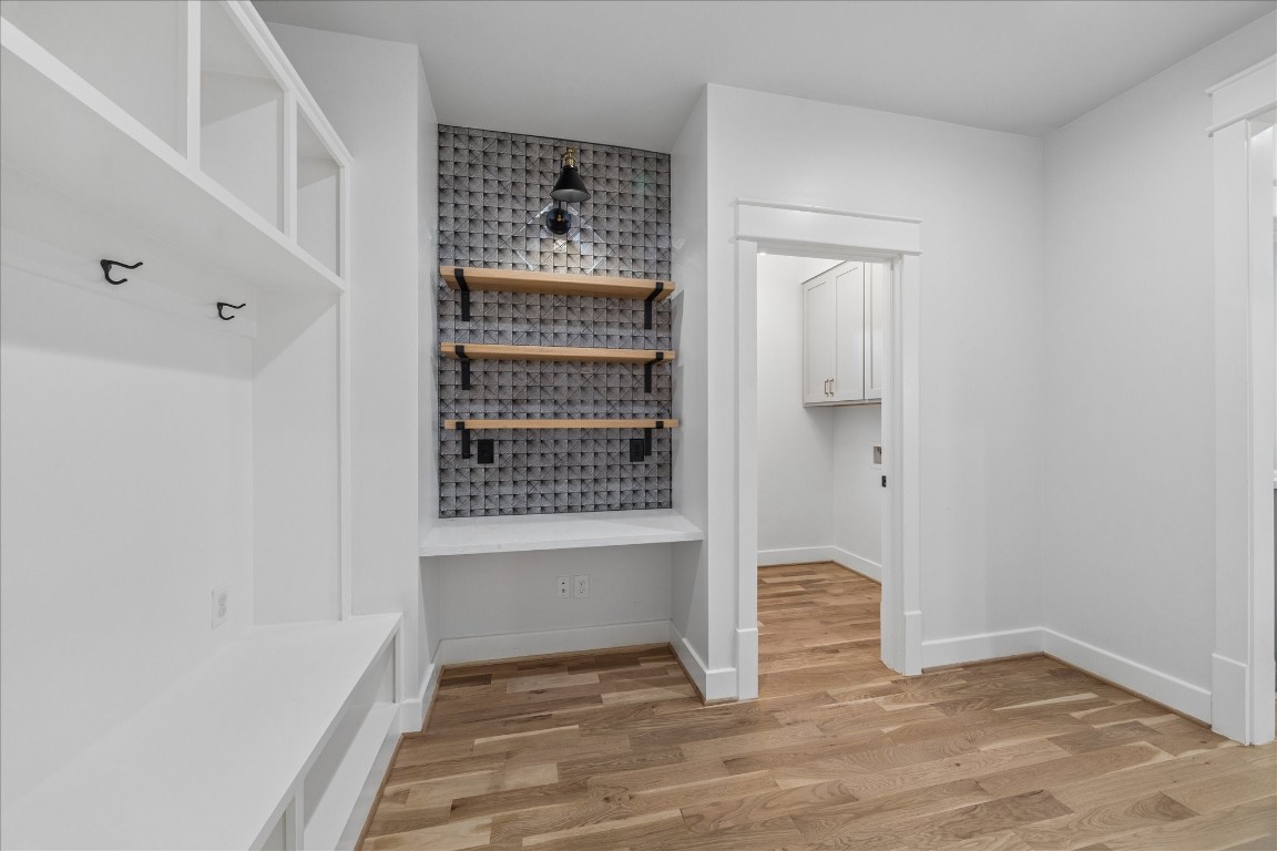 910 Northwood Street Houston, TX 77009 - Photo 20 of 41 a view of an empty room with wooden floor and a window