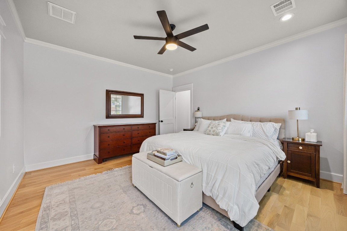 910 Northwood Street Houston, TX 77009 - Photo 24 of 41 a bedroom with a bed and a ceiling fan