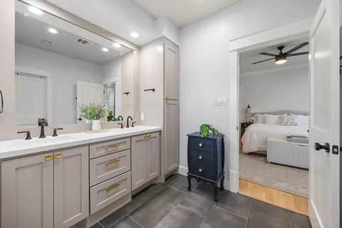a view of a livingroom with a ceiling fan and window