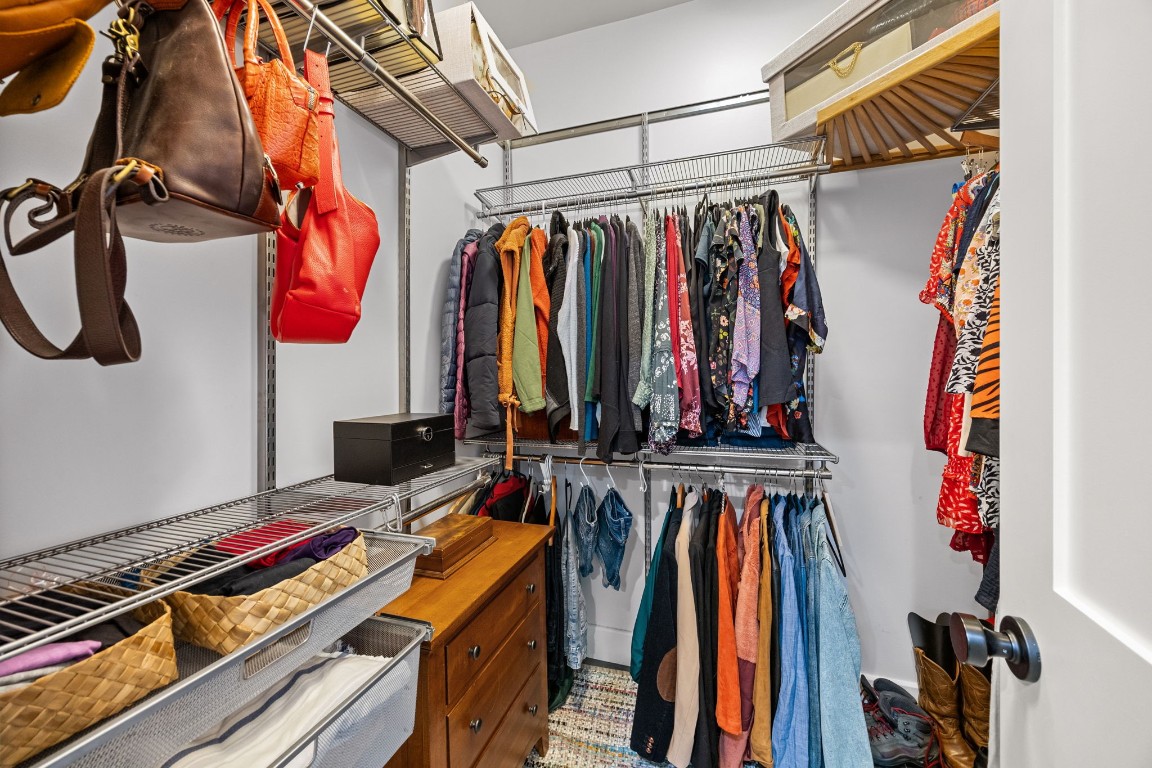 910 Northwood Street Houston, TX 77009 - Photo 27 of 41 a view of walk in closet with clothes and shoes