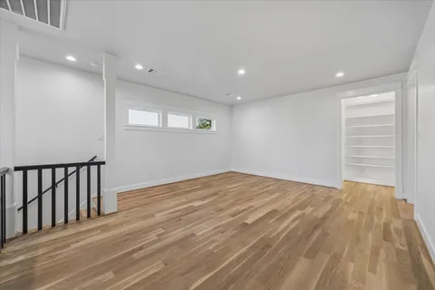 a view of an entryway with wooden floor and a window