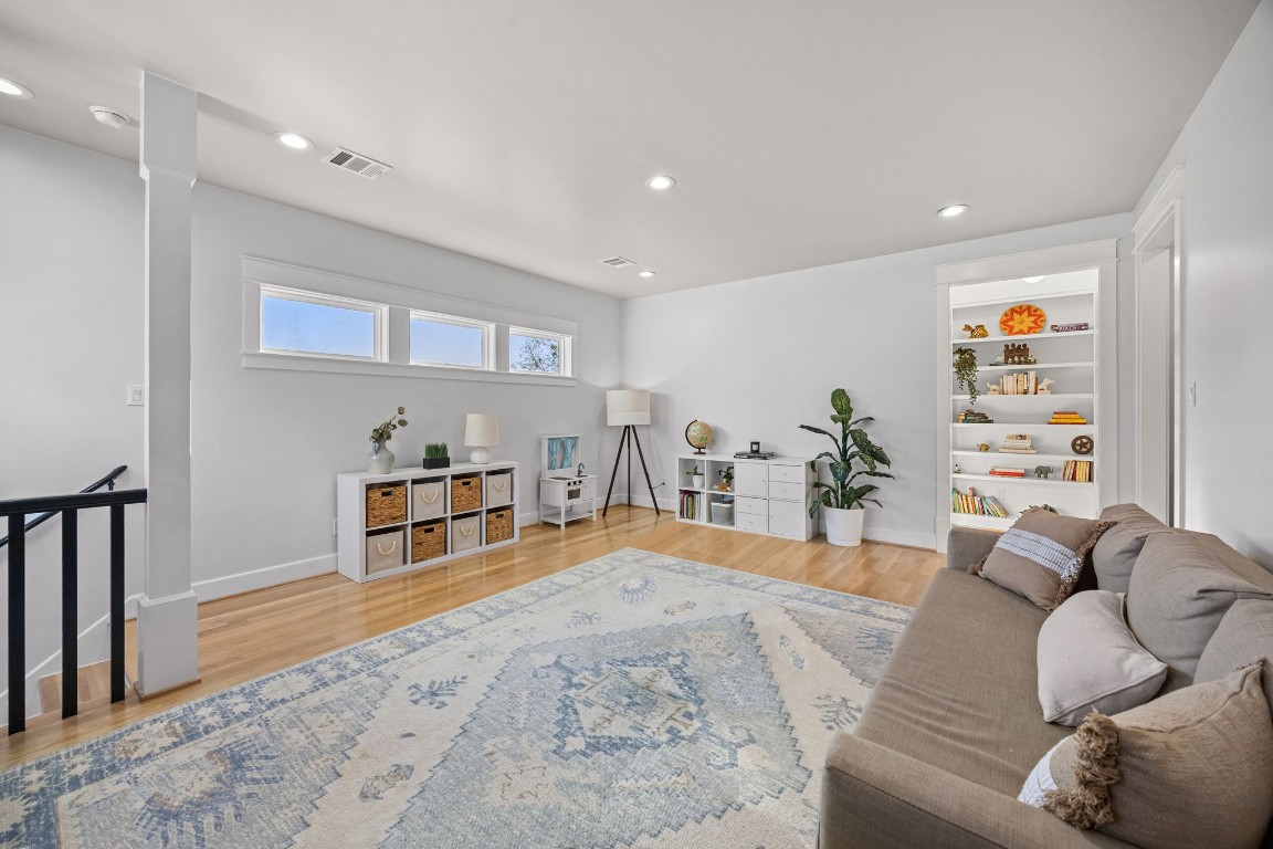 910 Northwood Street Houston, TX 77009 - Photo 34 of 41 a living room with furniture and a wooden floor