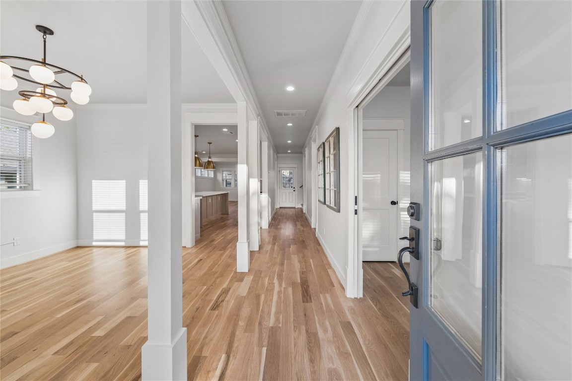910 Northwood Street Houston, TX 77009 - Photo 6 of 41 a view of a hallway view with wooden floor and staircase