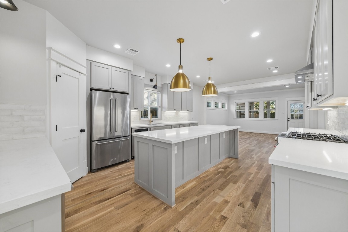 910 Northwood Street Houston, TX 77009 - Photo 10 of 41 a kitchen with stainless steel appliances granite countertop a refrigerator a stove a sink and a oven