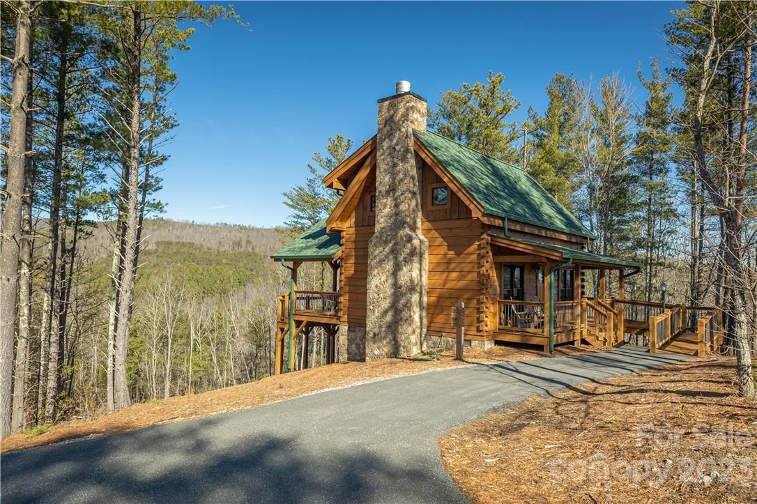9589 Shortoff View Terrace, Unit 29 Nebo, NC 28761 - Photo 20 of 25 a view of a house with a yard