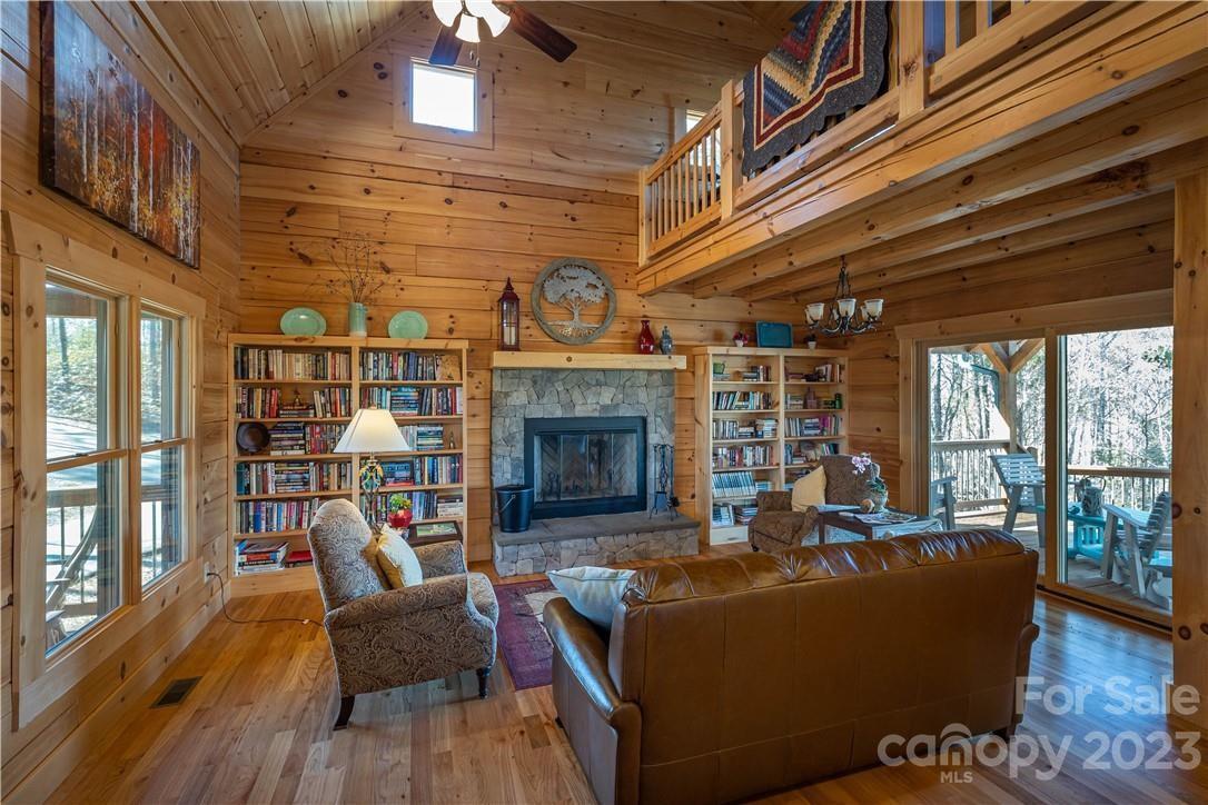 9589 Shortoff View Terrace, Unit 29 Nebo, NC 28761 - Photo 23 of 25 a living room with furniture and a fireplace