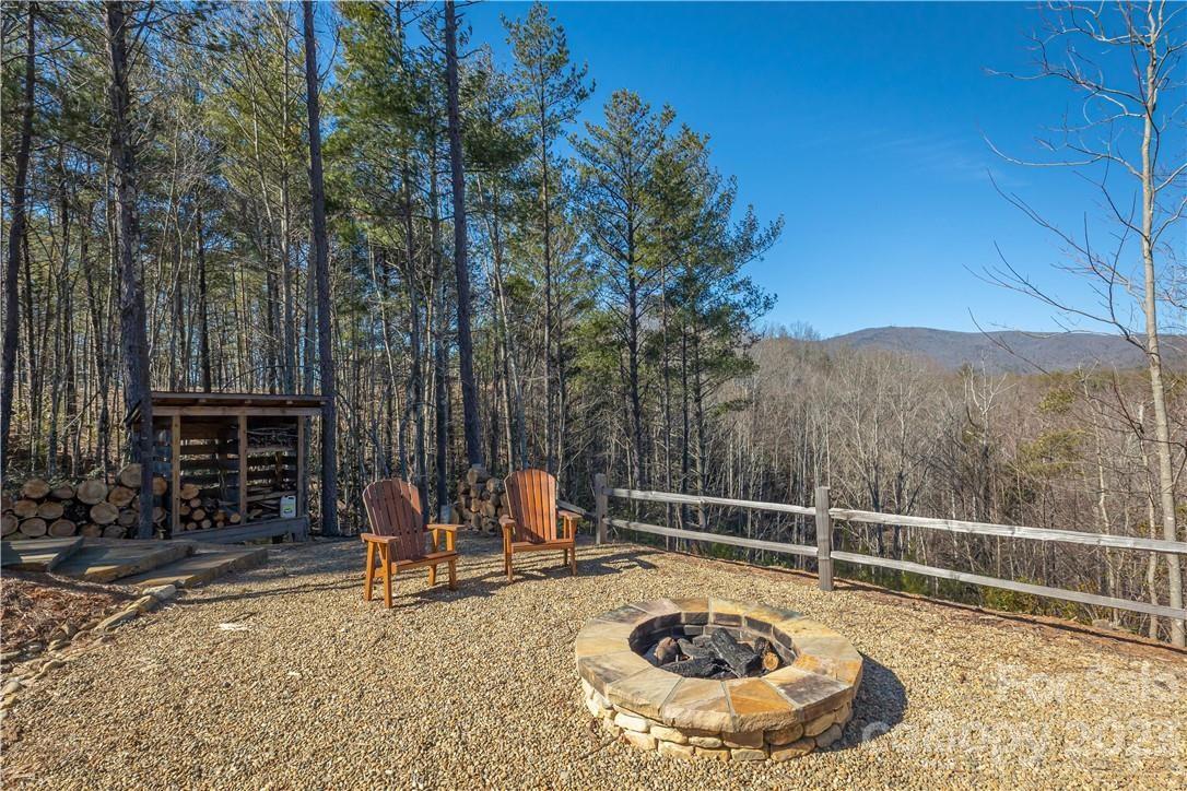 9589 Shortoff View Terrace, Unit 29 Nebo, NC 28761 - Photo 24 of 25 a view of a swimming pool with a lounge chair