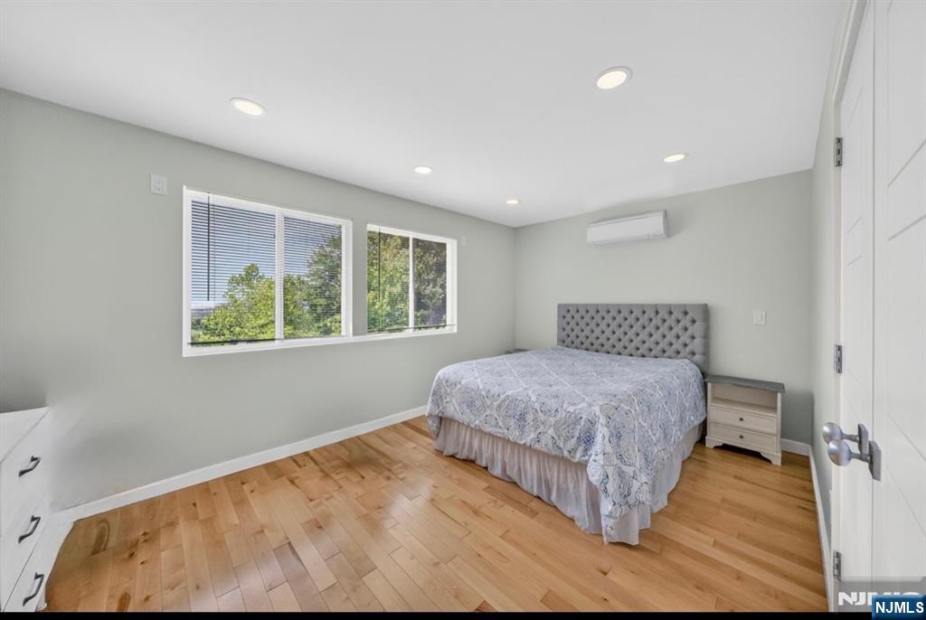 57 Hemlock Road Little Falls, NJ 07424 - Photo 25 of 50 a bedroom with a large bed and a window