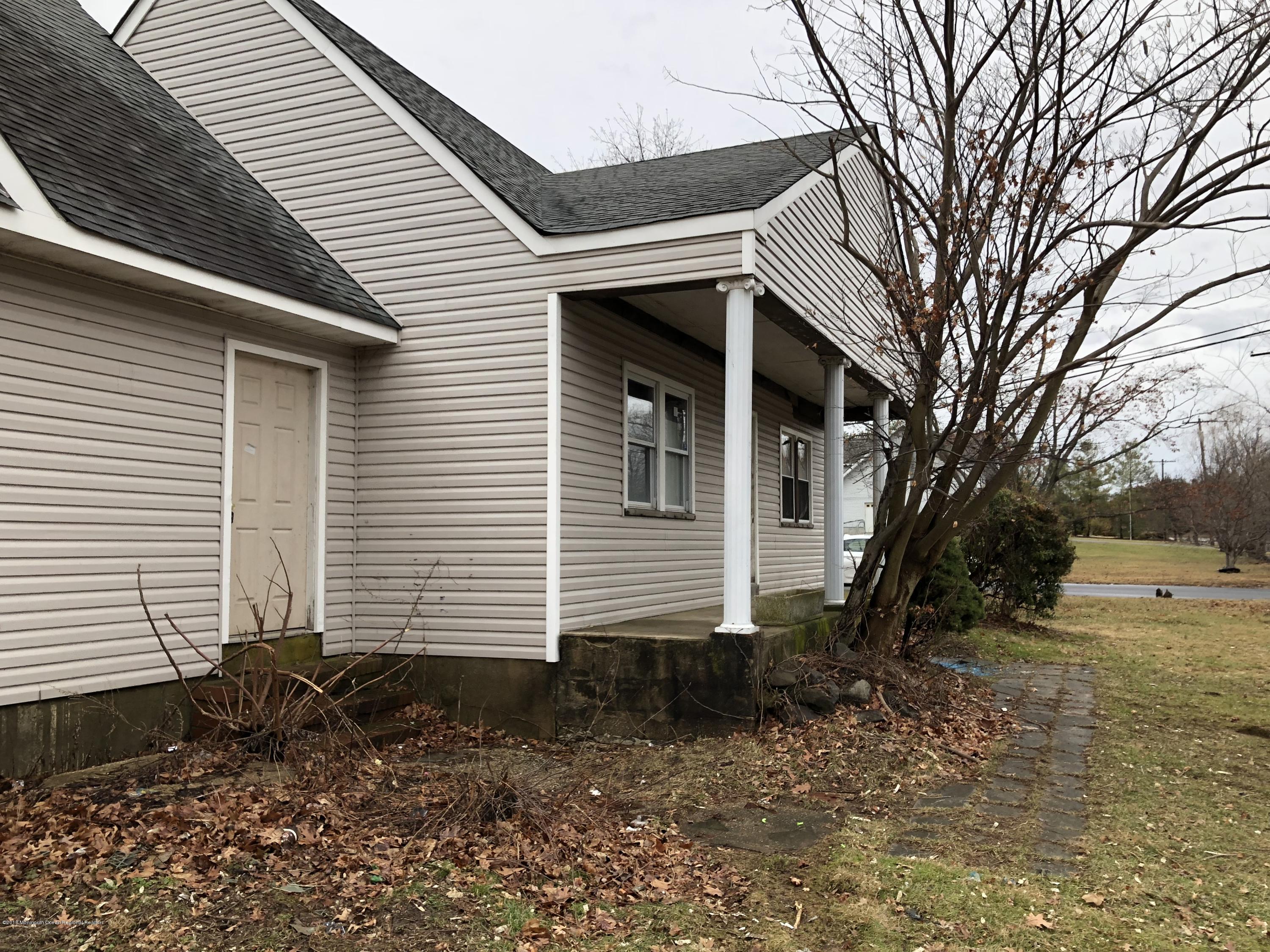 259 Amboy Road Matawan, NJ 07747 - Photo 3 of 15 a view of a house with a yard
