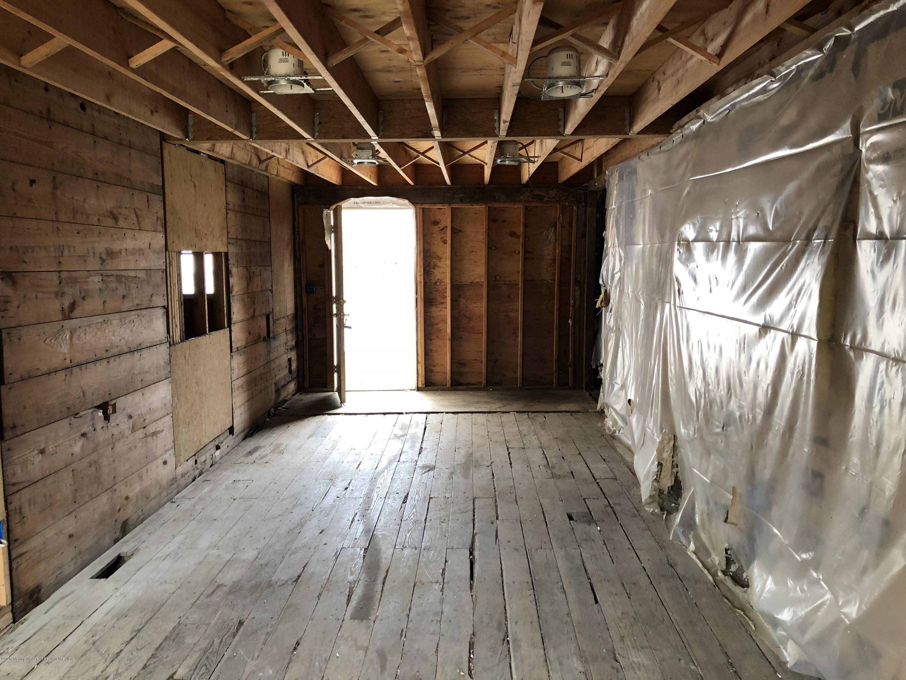 259 Amboy Road Matawan, NJ 07747 - Photo 5 of 15 a view of hallway with wooden floor