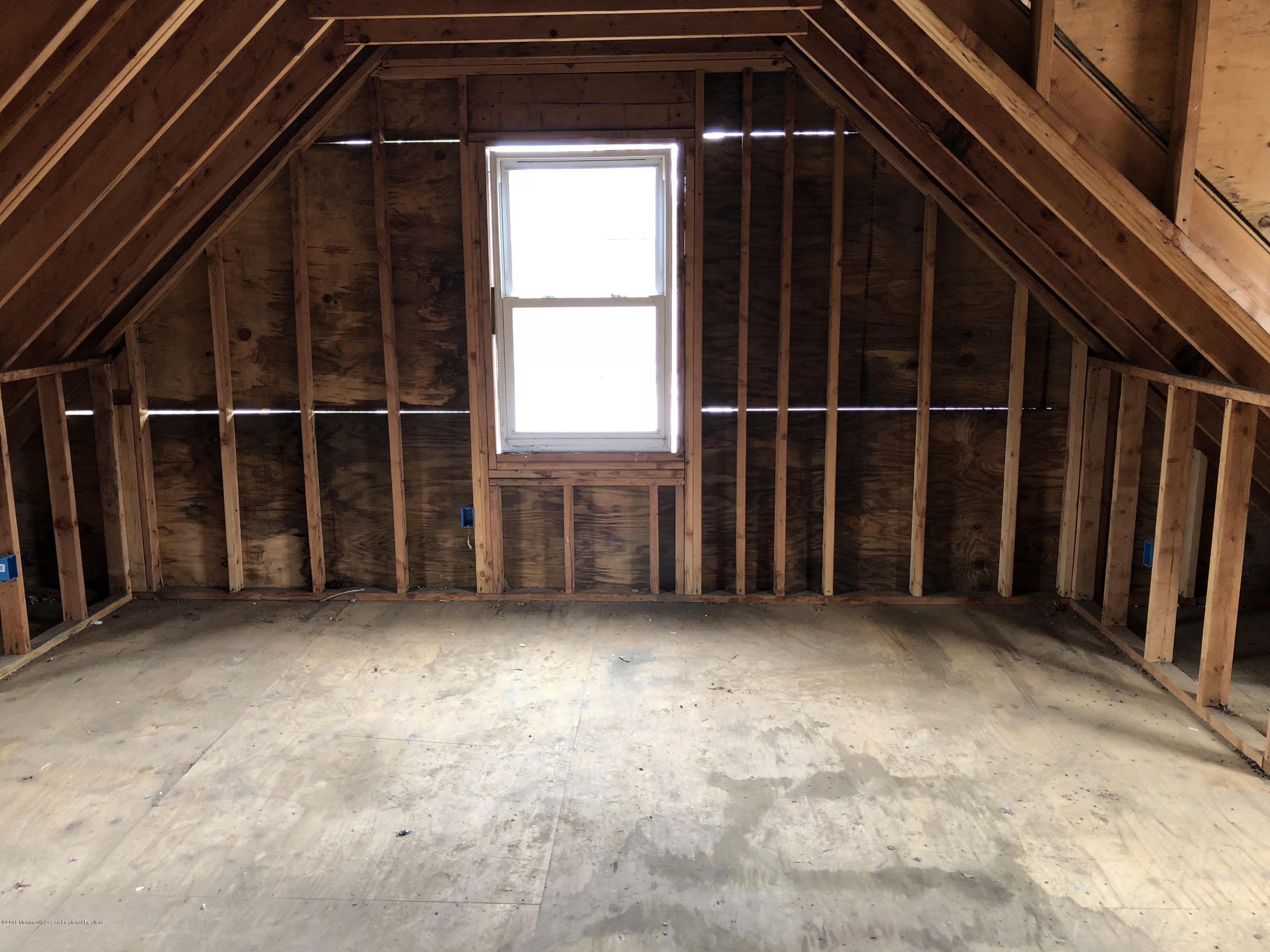 259 Amboy Road Matawan, NJ 07747 - Photo 7 of 15 an empty room with windows