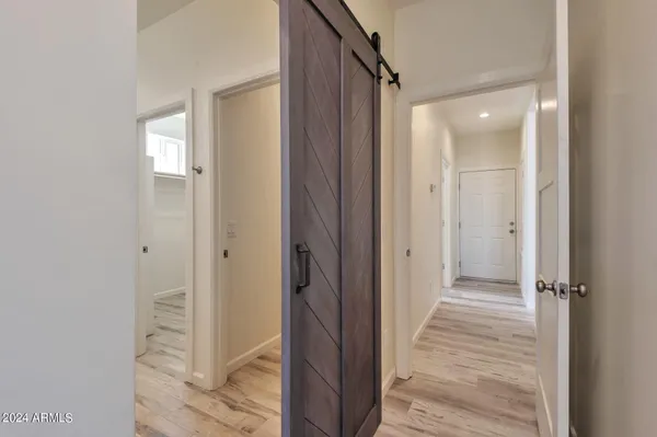 a view of a bathroom from a hallway