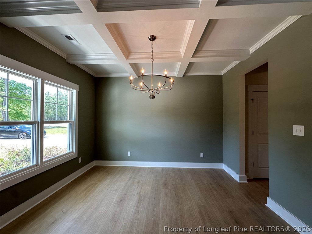 2908 Calloway Road Raeford, NC 28376 - Photo 3 of 25 a view of empty room with wooden floor and fan