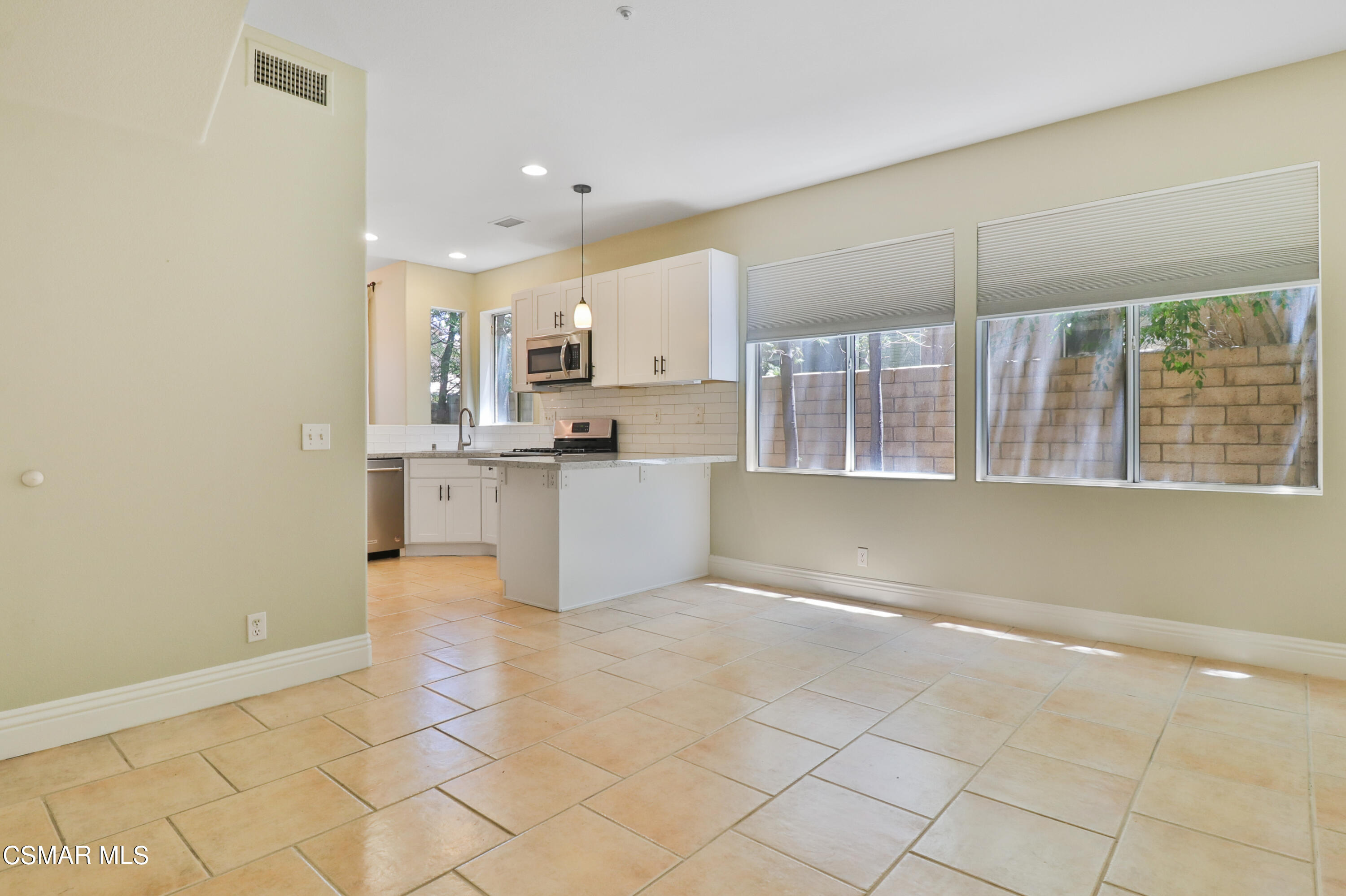 292 Maywind Lane Simi Valley, CA 93065 - Photo 19 of 41 a view of kitchen with kitchen island microwave and cabinets