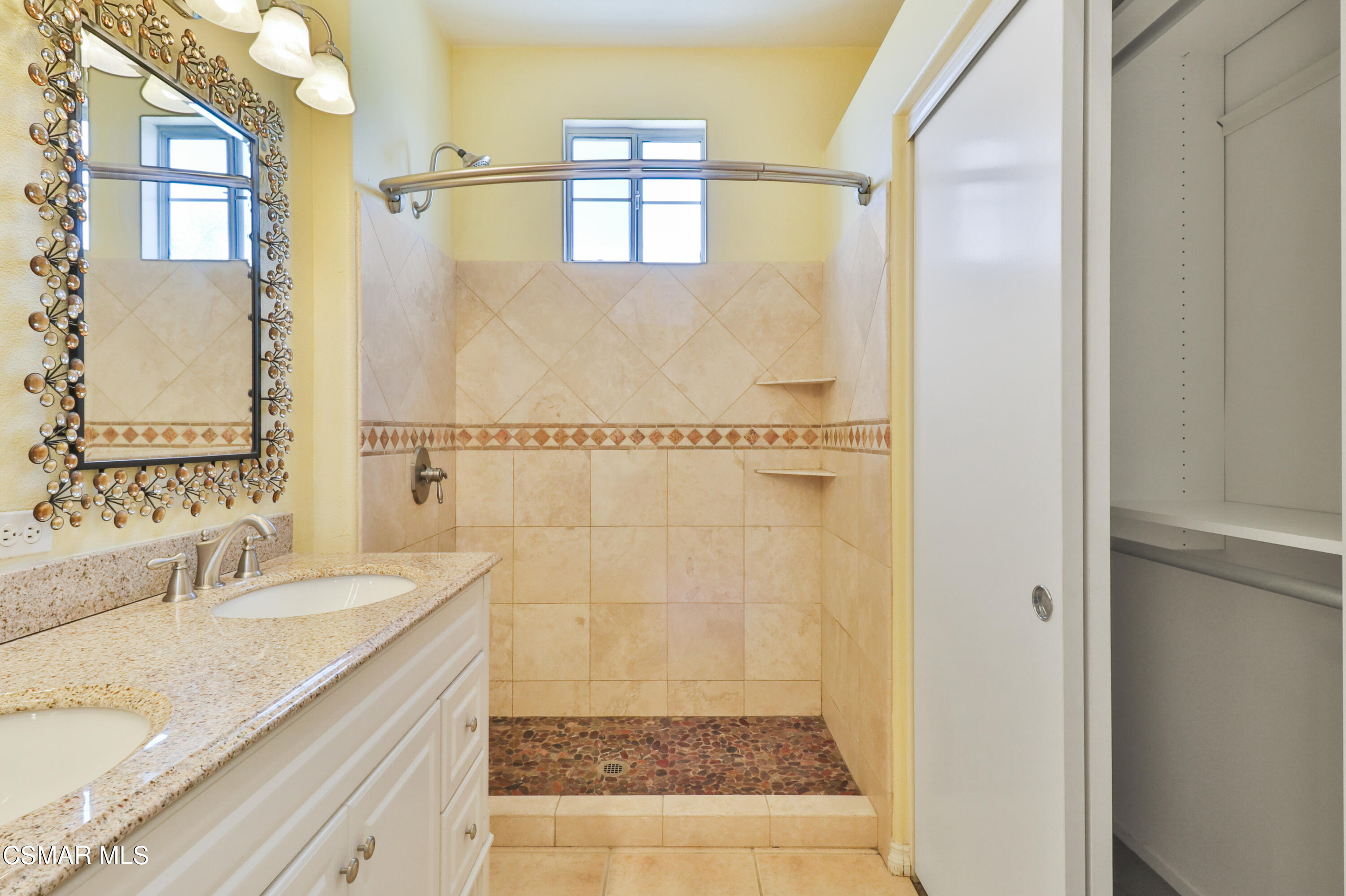 292 Maywind Lane Simi Valley, CA 93065 - Photo 30 of 41 a bathroom with a granite countertop sink a mirror and a shower