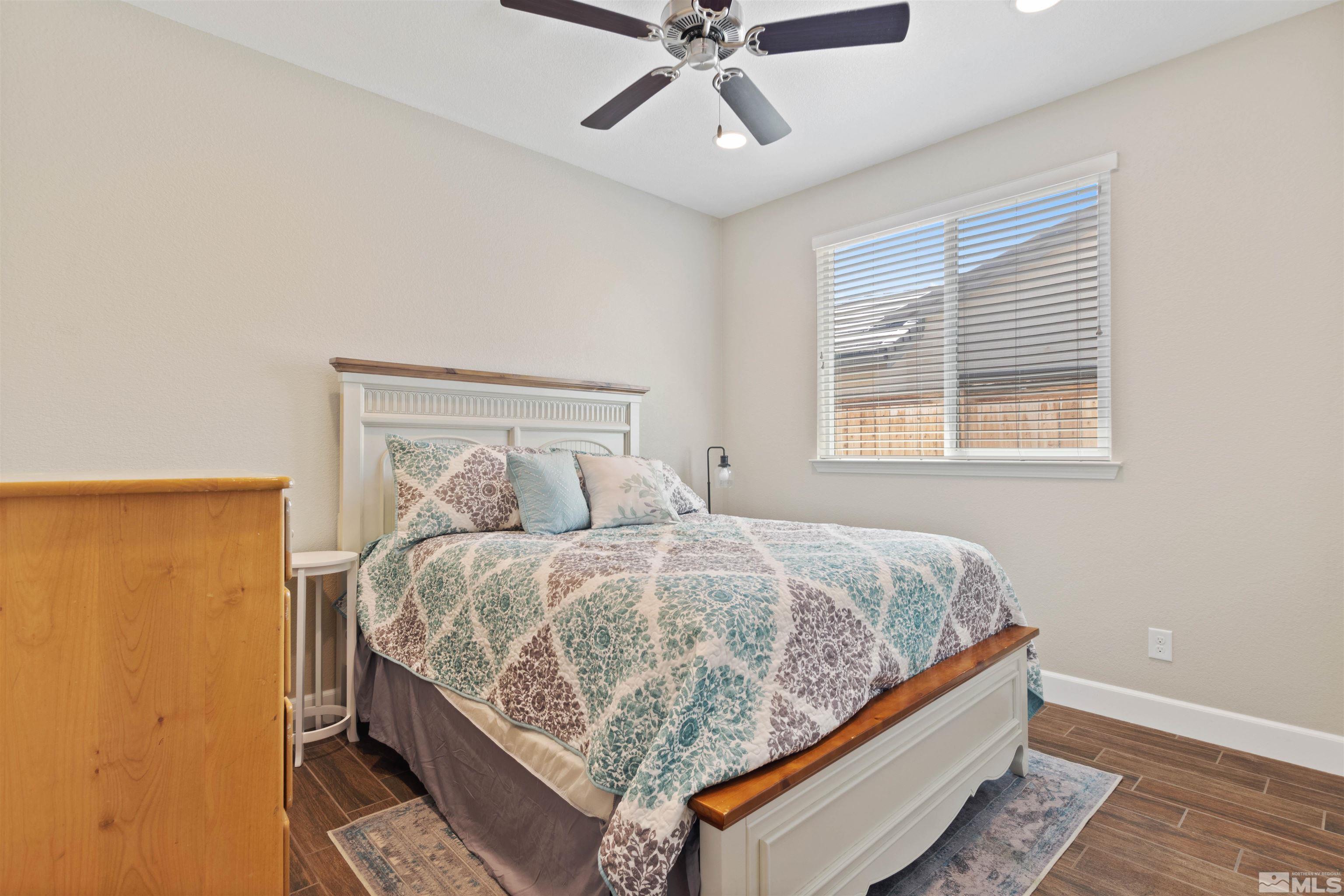 855 Larrimore Trail Reno, NV 89523 - Photo 20 of 26 a bed sitting in a bedroom next to a window