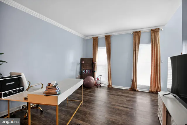 a room with furniture and a flat screen tv