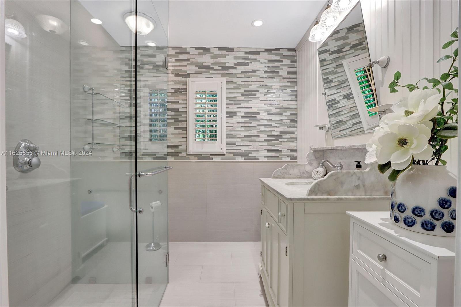 9290 Southwest 117th Terrace Miami, FL 33176 - Photo 14 of 26 a bathroom with a sink a vanity and a shower