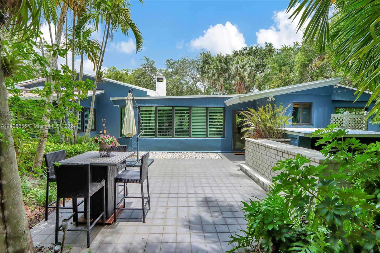 9290 Southwest 117th Terrace Miami, FL 33176 - Photo 18 of 26 a view of backyard of house with seating space