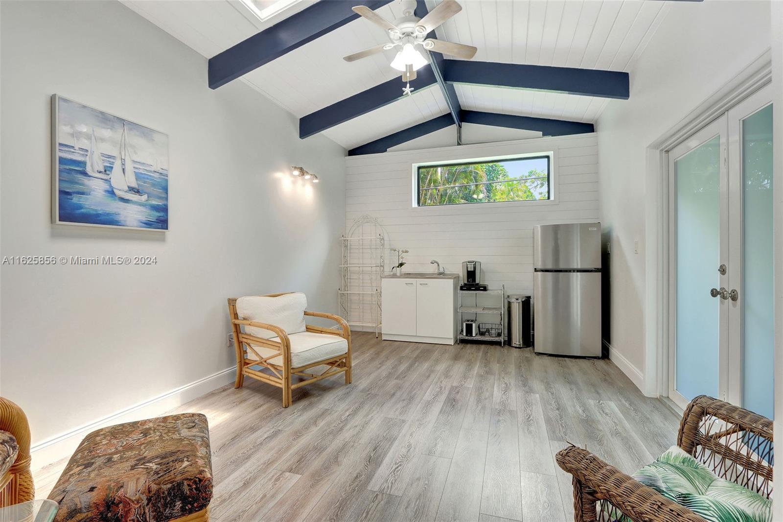 9290 Southwest 117th Terrace Miami, FL 33176 - Photo 21 of 26 a living room with furniture and a wooden floor