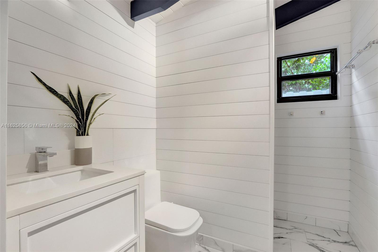 9290 Southwest 117th Terrace Miami, FL 33176 - Photo 23 of 26 a bathroom with a toilet and a sink