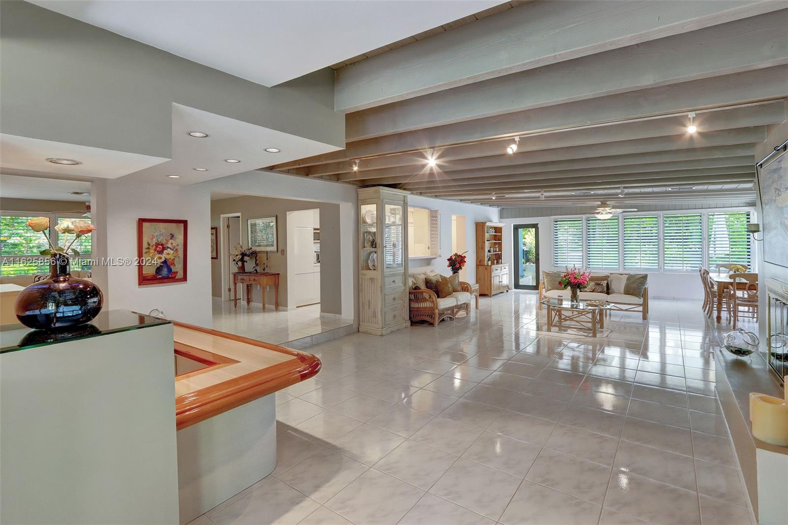 9290 Southwest 117th Terrace Miami, FL 33176 - Photo 3 of 26 a living room with furniture and a table